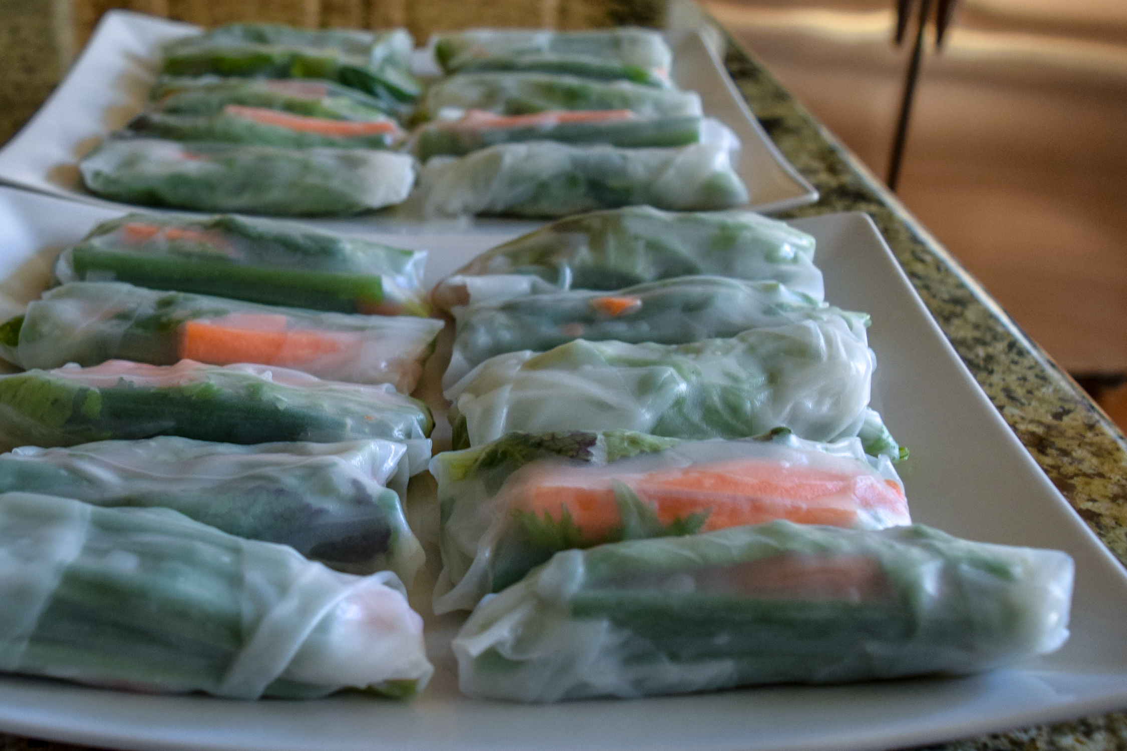 Veggie spring rolls on trays from front