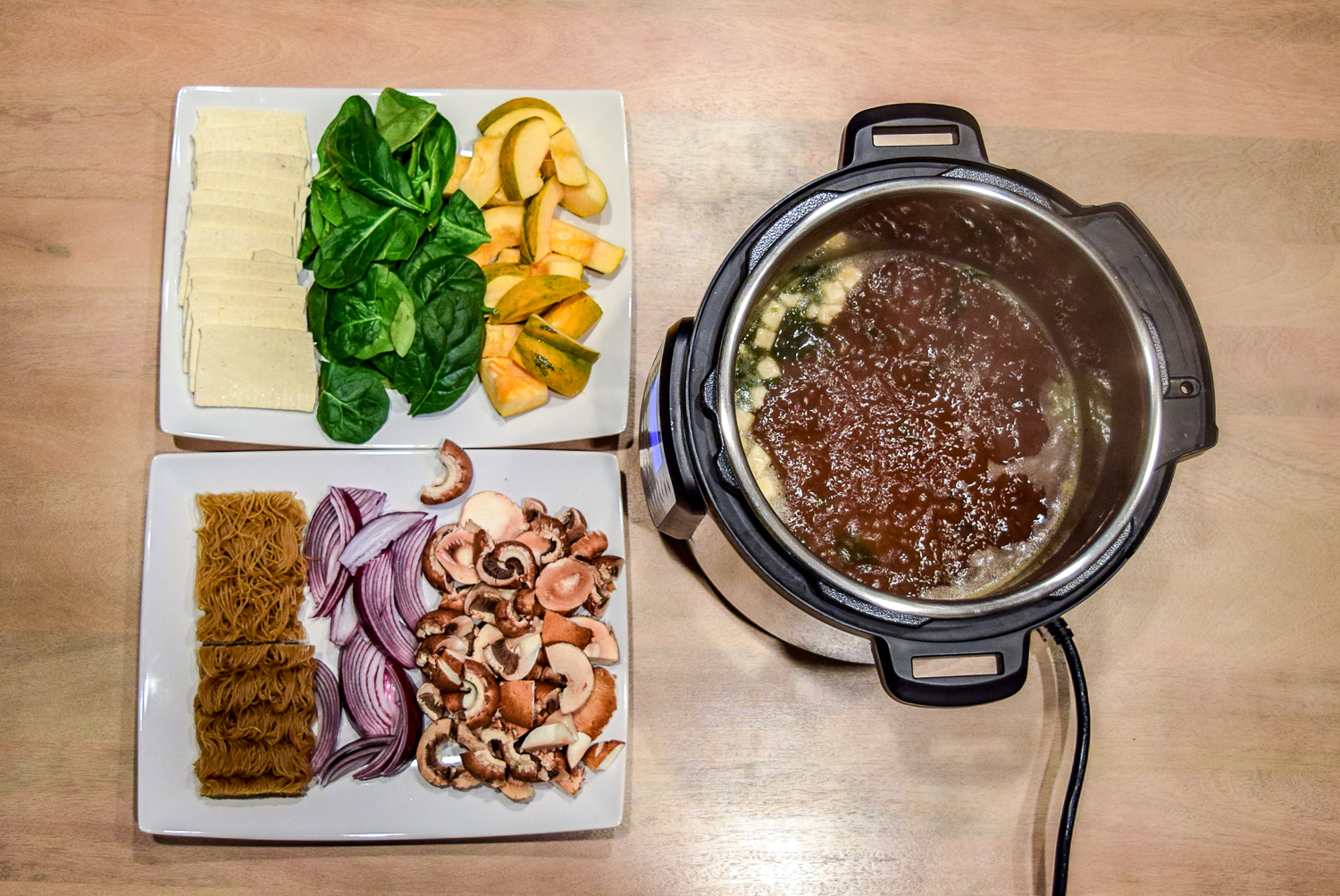 Instant Pot Hot Pot with Vegetables, Tofu, and Ramen Noodles boiling from top