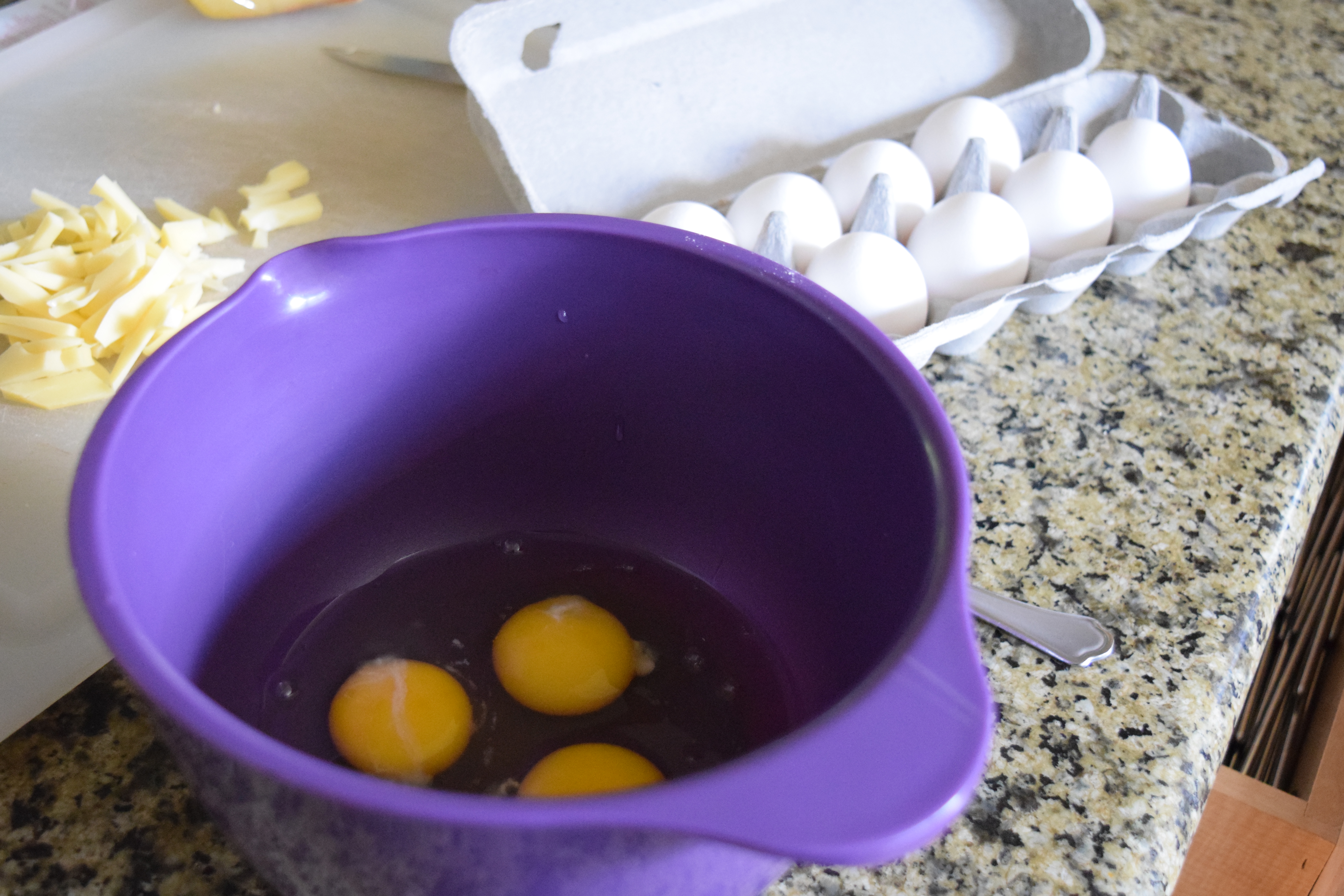 Eggs cracked in mixing bowl