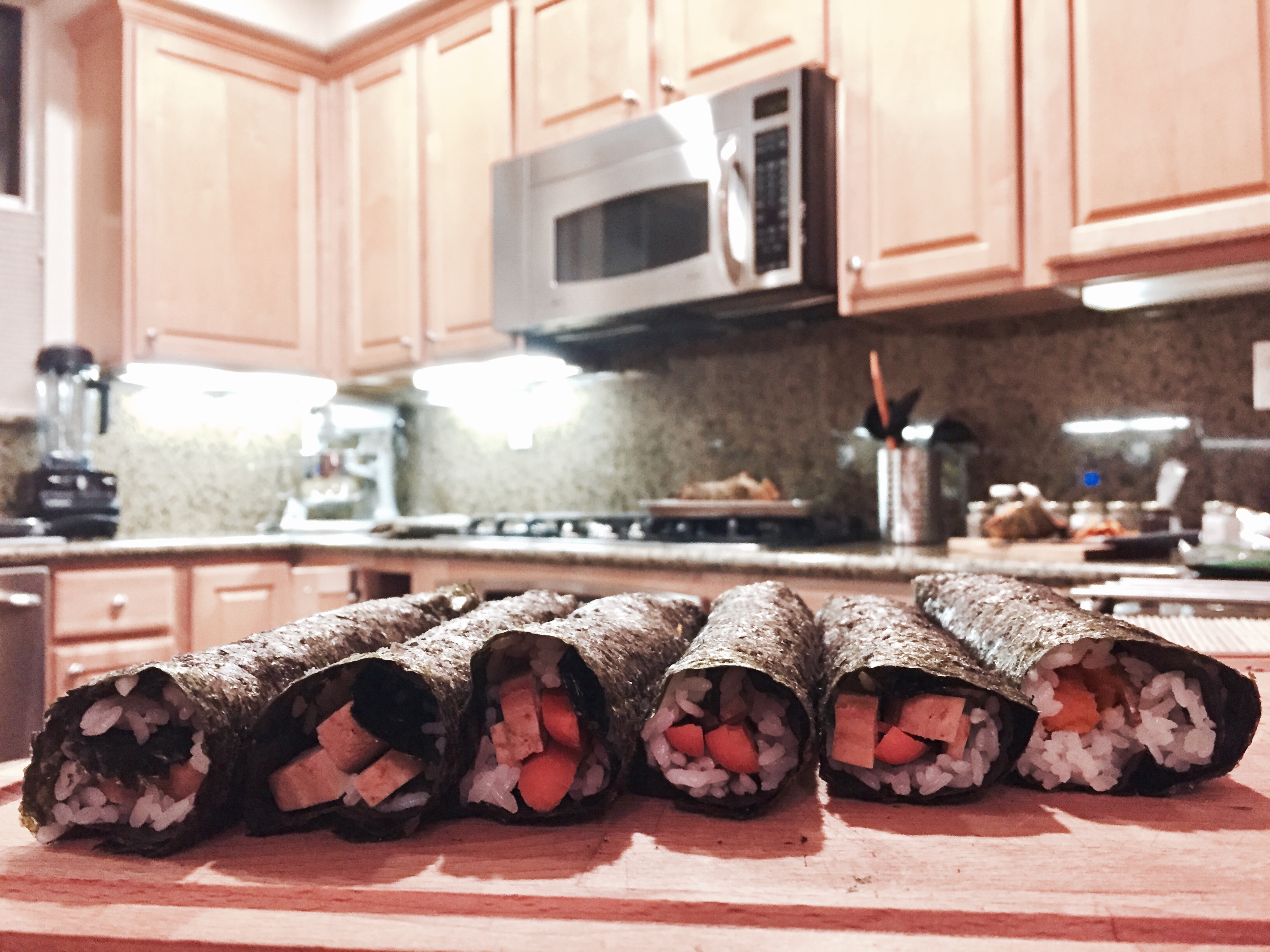 Teriyaki Tofu and Veggie Sushi rolls before cutting