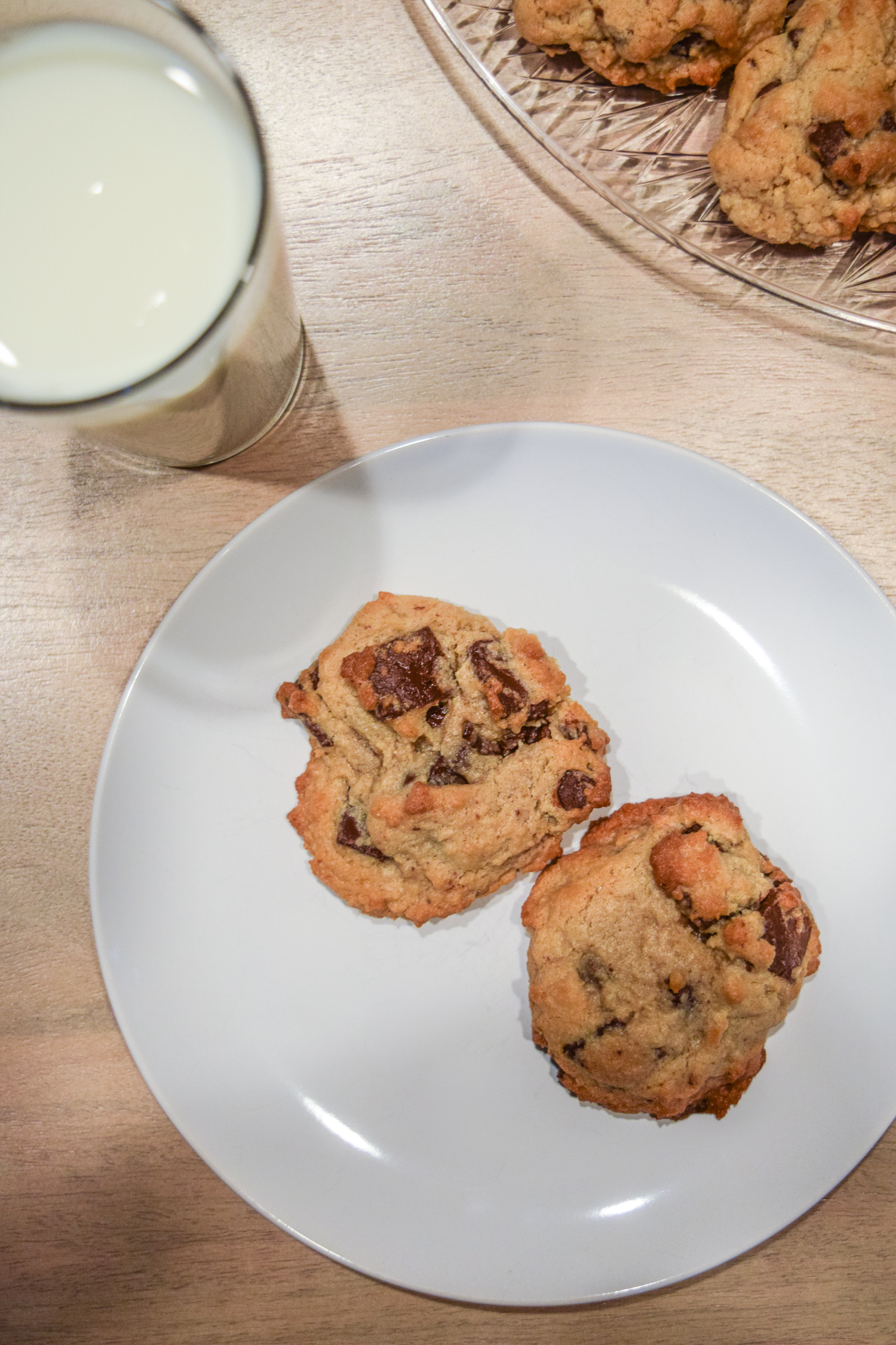 Specialty's Semi-Sweet Chocolate Chunk Cookies with glass of milk from above
