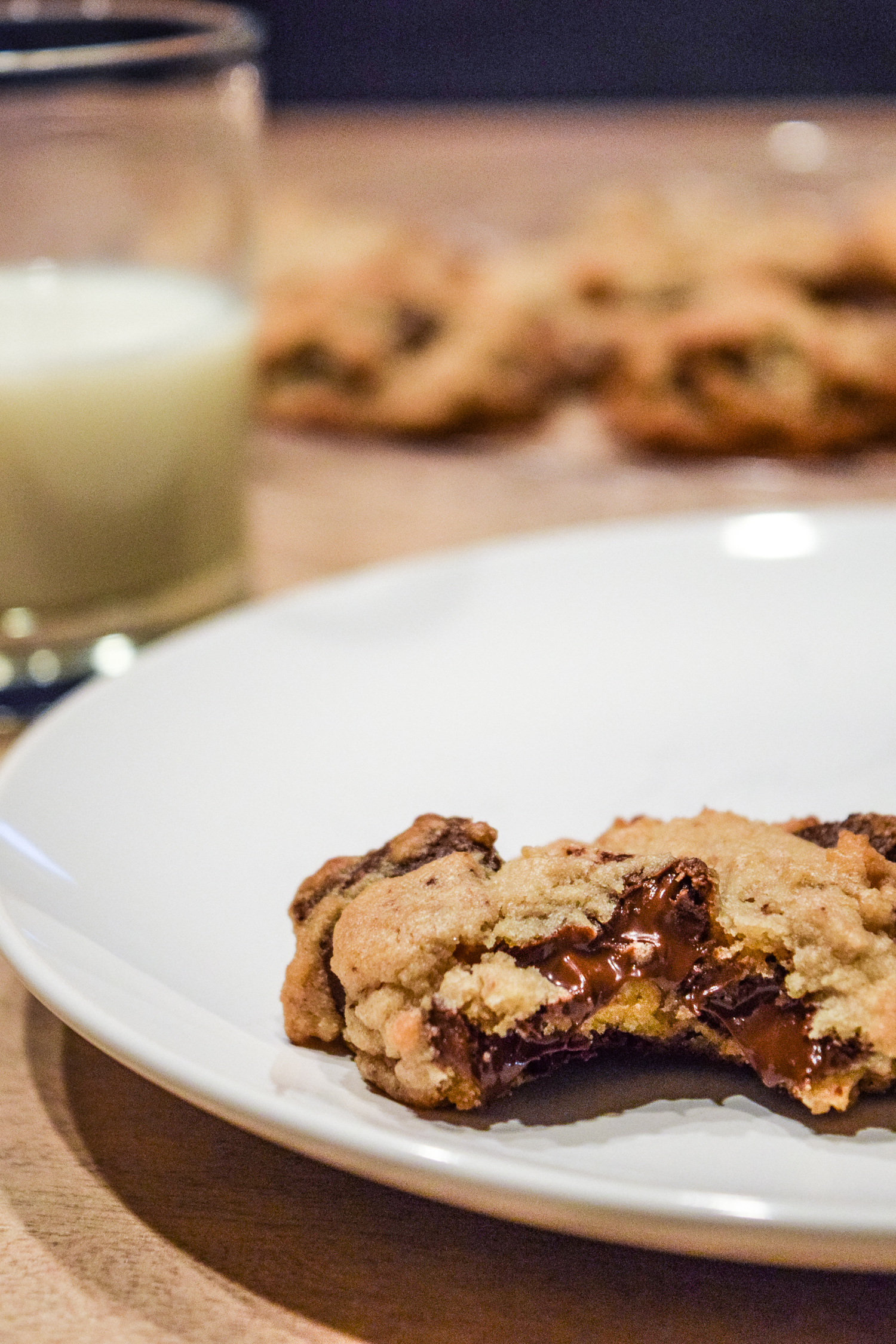 Specialty's Semi-Sweet Chocolate Chunk Cookies with gooey chocolate and glass of milk