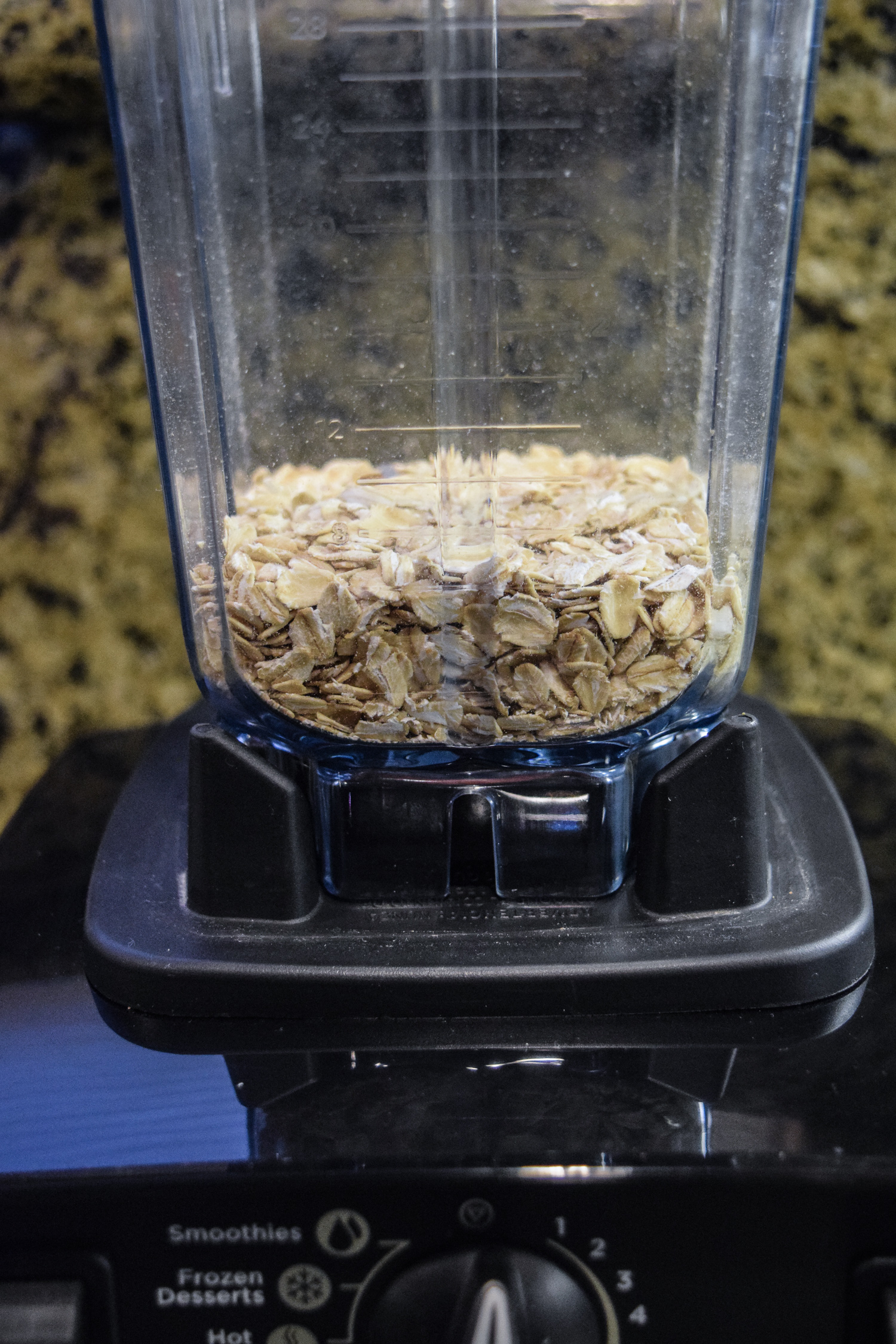 Oats in Vitamix dry grains container from the side