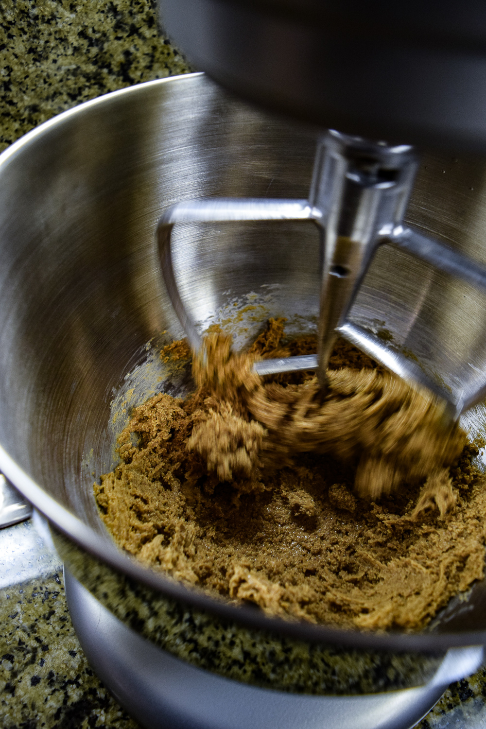 Creaming together the peanut butter and brown sugar in KitchenAid Mixer bowl in action