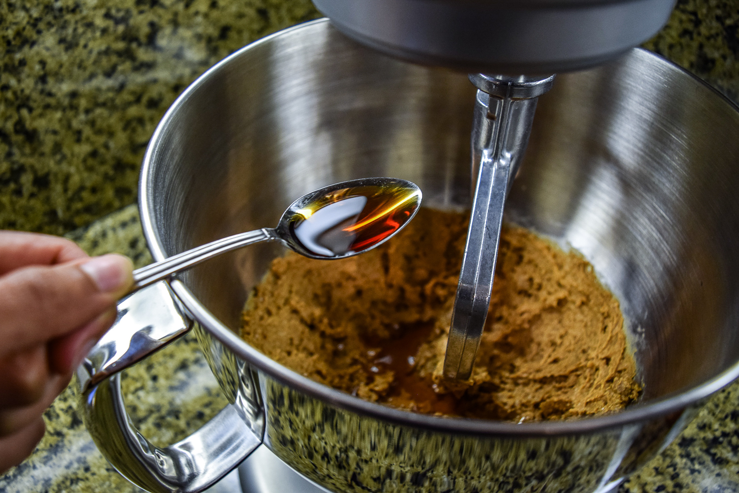 Adding the vanilla extract to the KitchenAid Mixer bowl