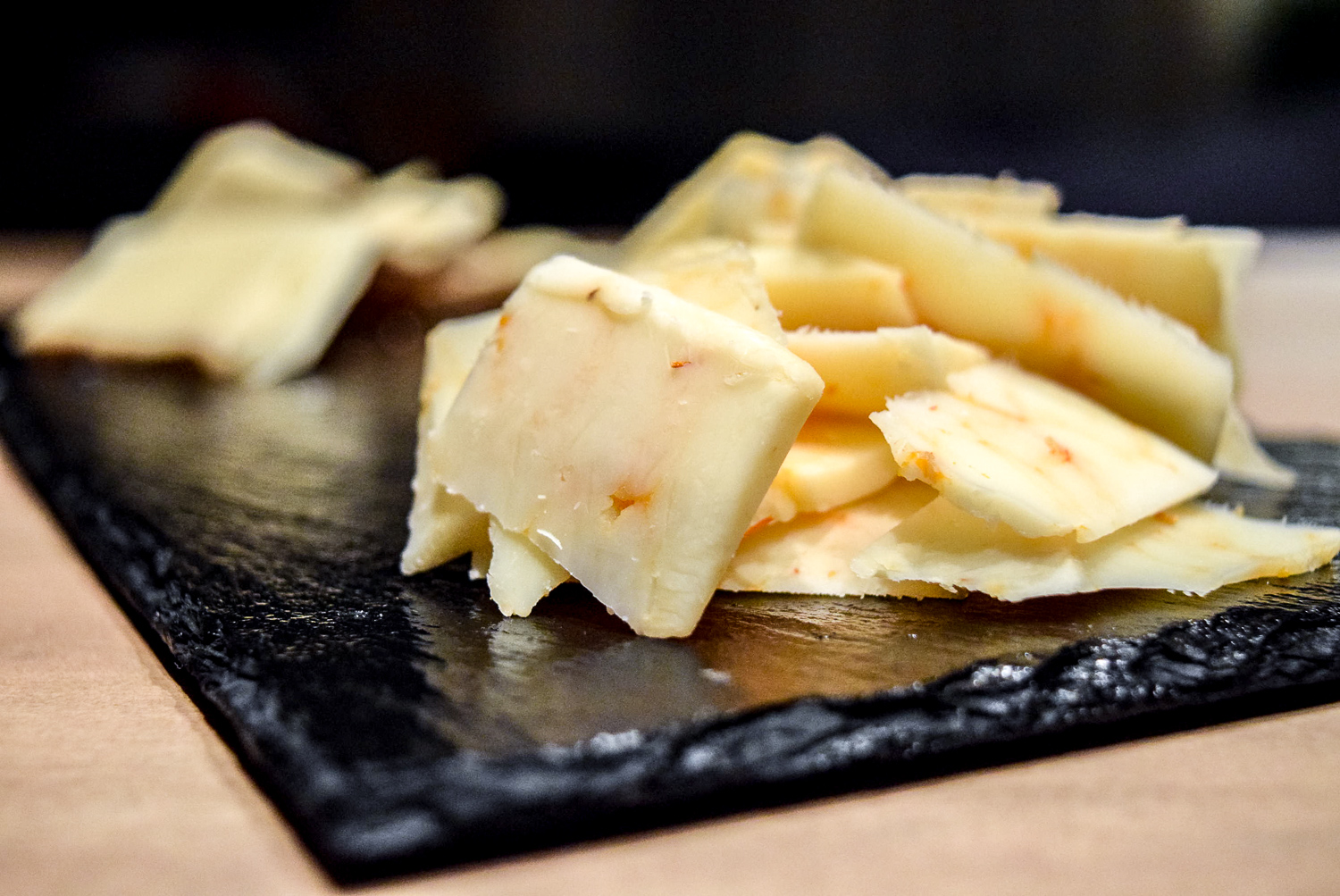 Close up on Trader Joe's Ghost Pepper Cheddar on Gluten-Free Peppery Slate Cheeseboard