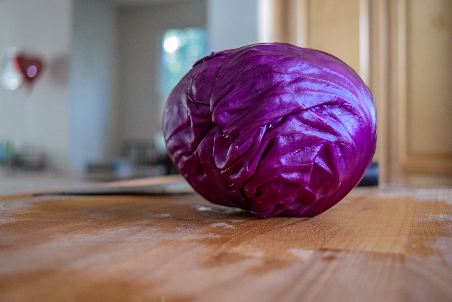 Whole red cabbage for Sunshine Spicy Mustard Tahini Cruciferous Slaw