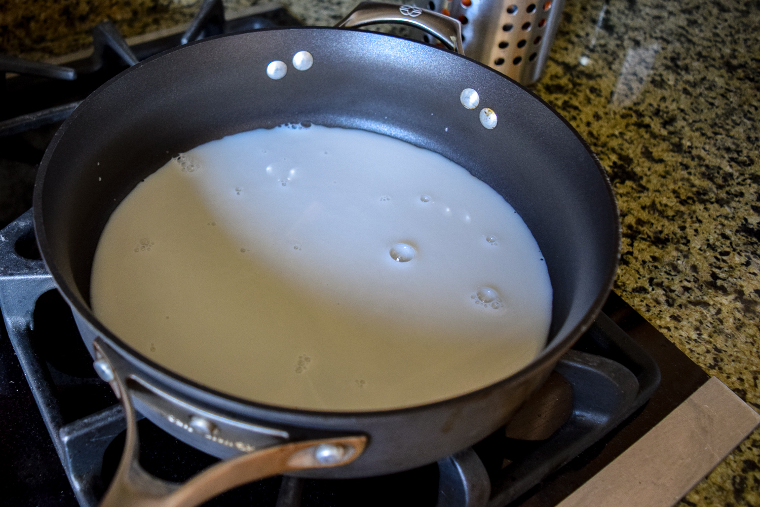 Heating up milk in Calphalon sauce pan for chocolate ganache