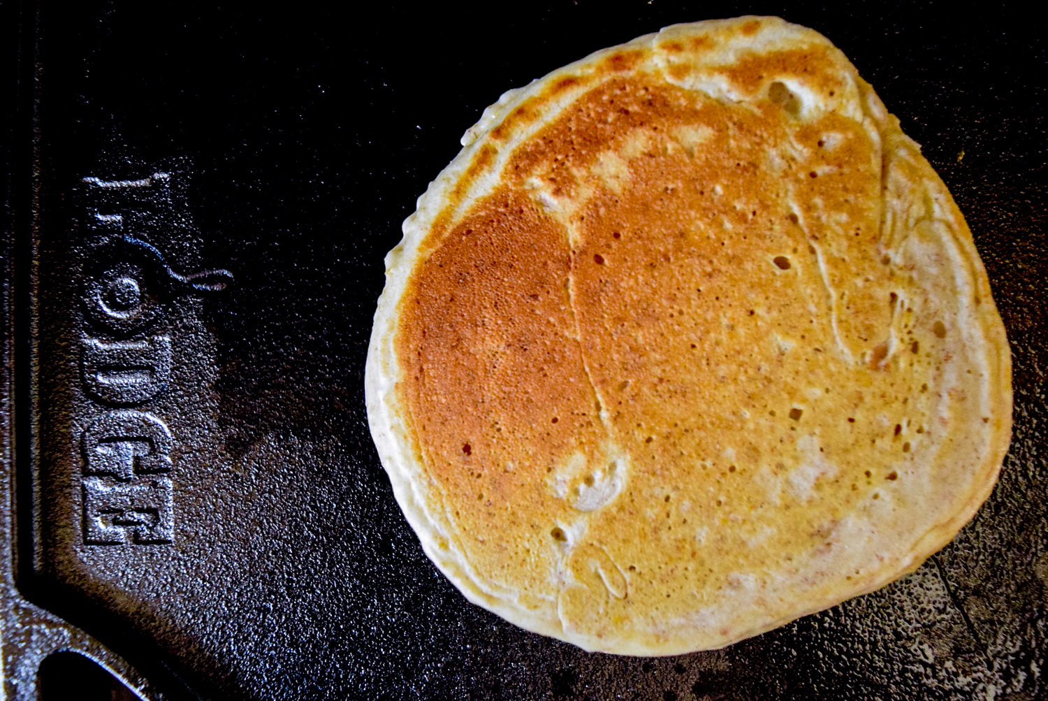 Trader Joe's Multigrain Pancake Mix flipped over on Lodge Cast Iron Reversible Griddle/Grill