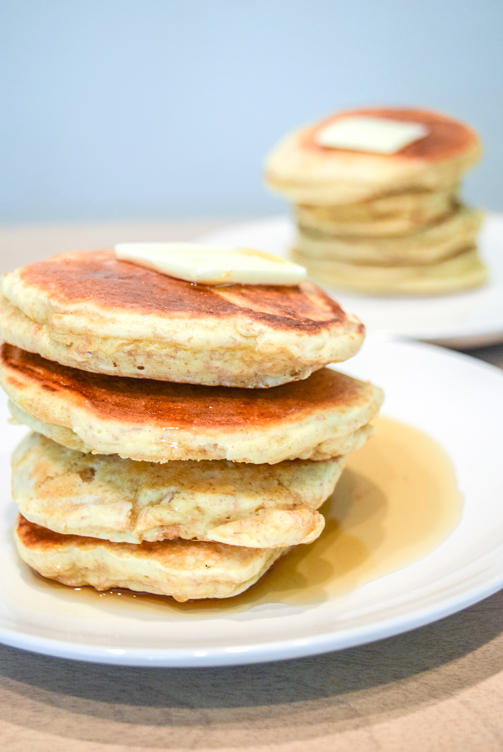 Trader Joe's Multigrain Pancake Mix stacks with butter and maple syrup from left side
