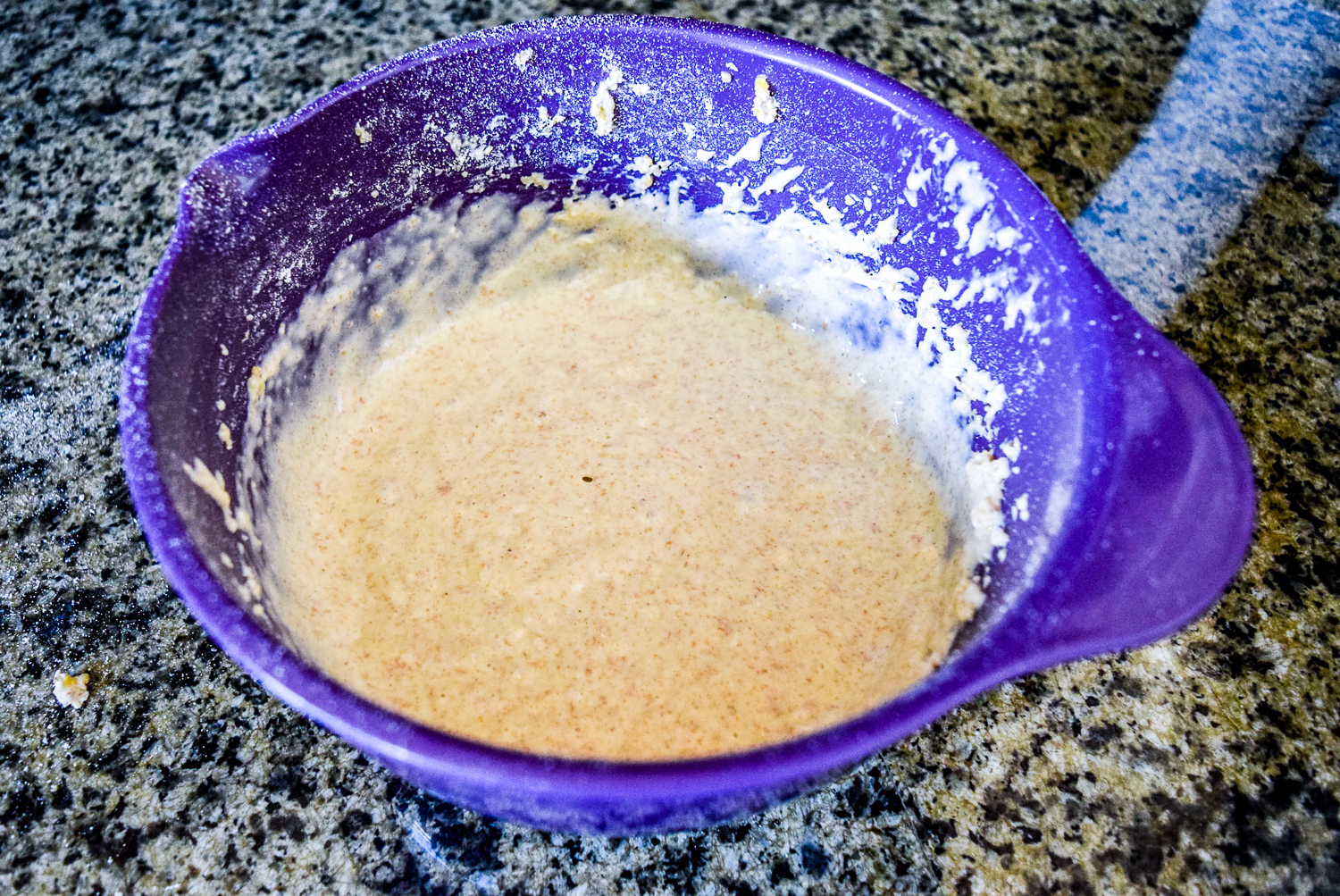 Trader Joe's Multigrain Baking & Pancake Mix, Milk, Canola Oil, and Eggs mixed together in KitchenAid Mixing Bowl to form pancake batter