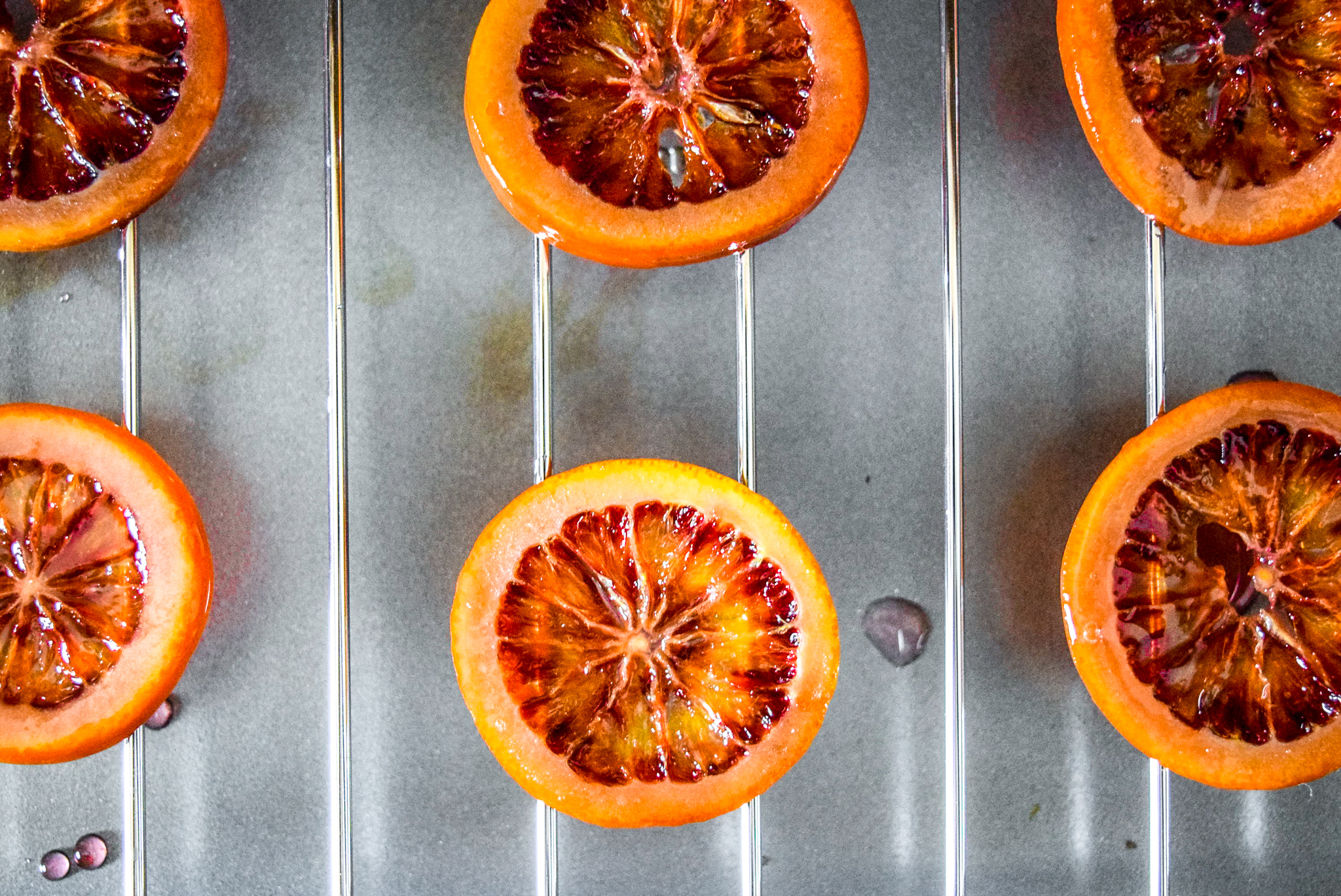 Two-Ingredient Candied Blood Orange Rounds drying and hardening after candying from top