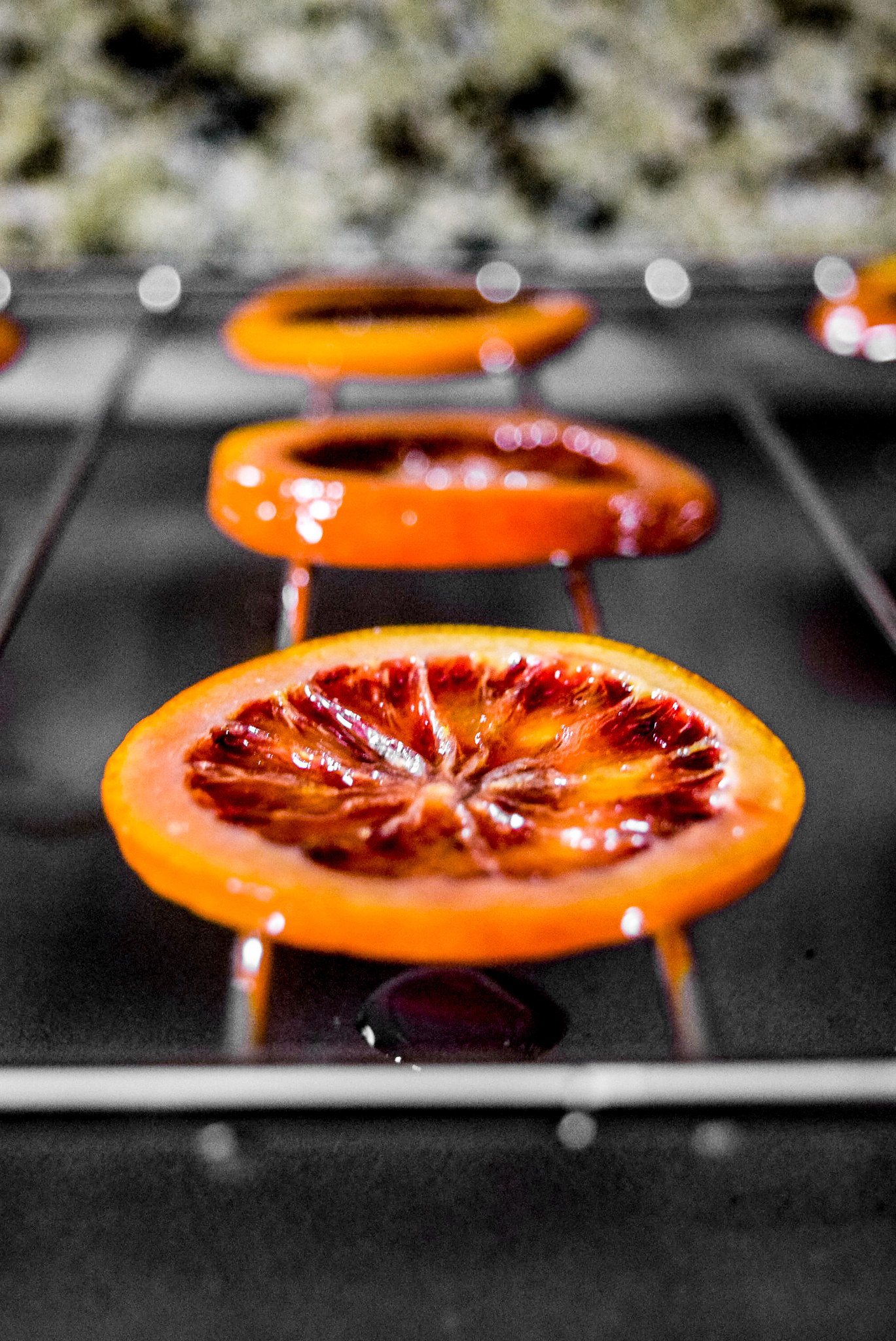 Two-Ingredient Candied Blood Orange Rounds drying and hardening after candying up close
