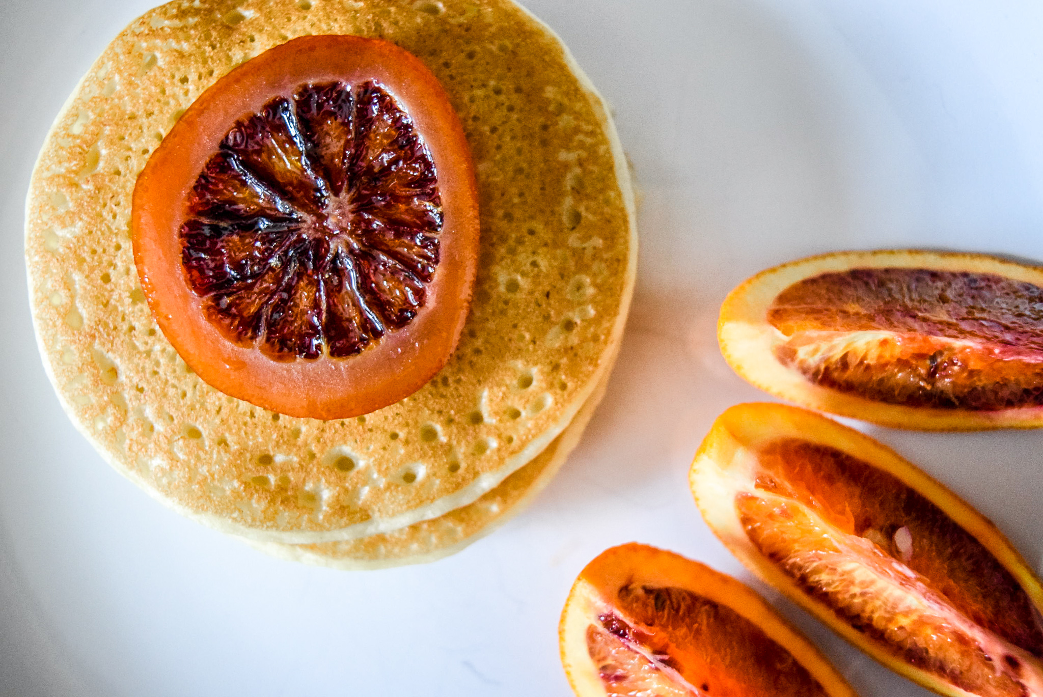 Trader Joe’s frozen pancakes with blood orange slices and candied blood orange round topping from top up close