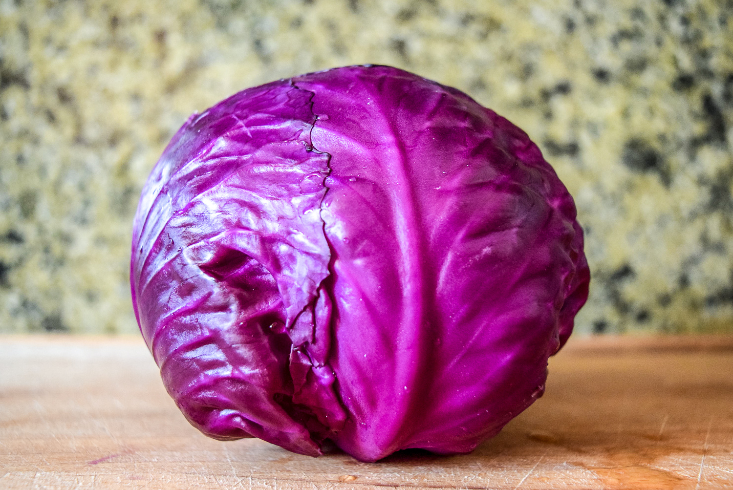 Red cabbage on wooden cuttingboard