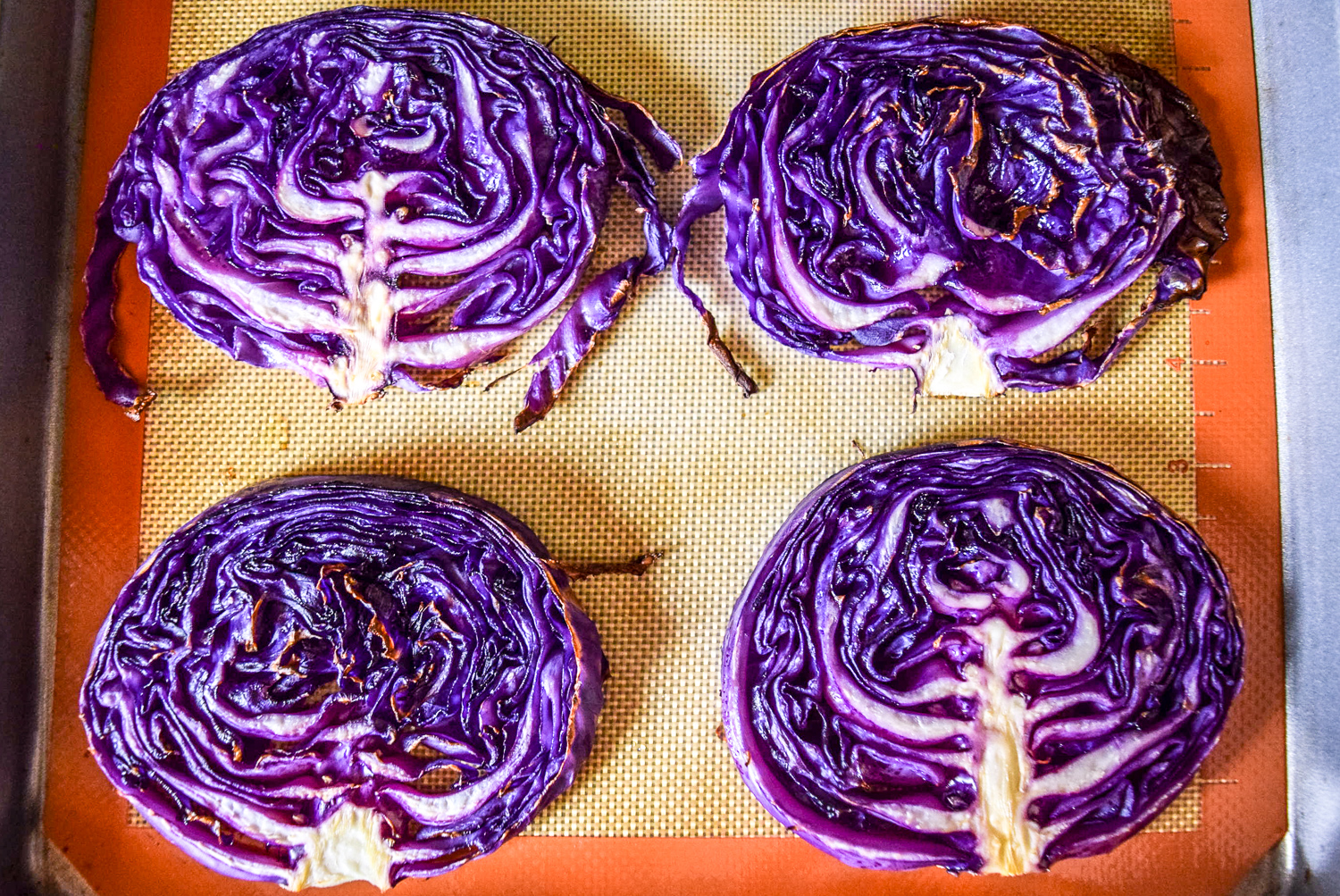 Roasted red cabbage steaks on sheet pan